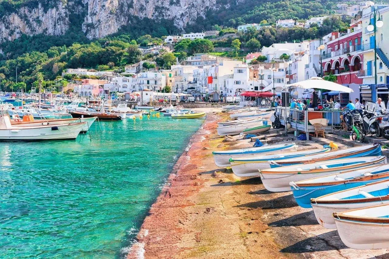 Small boats on the beach at the marina on Capri