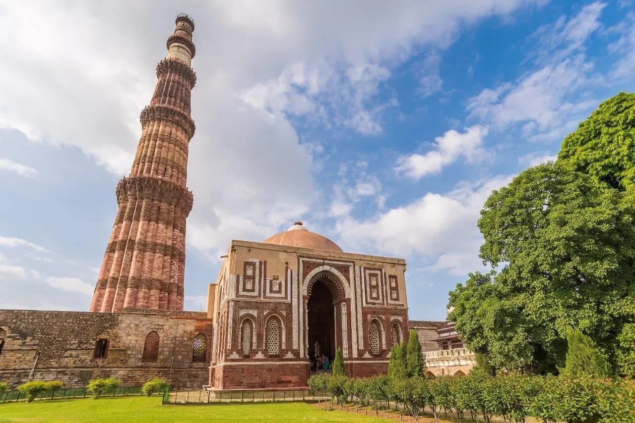 The Qutub Minar and its carved gateway in Delhi