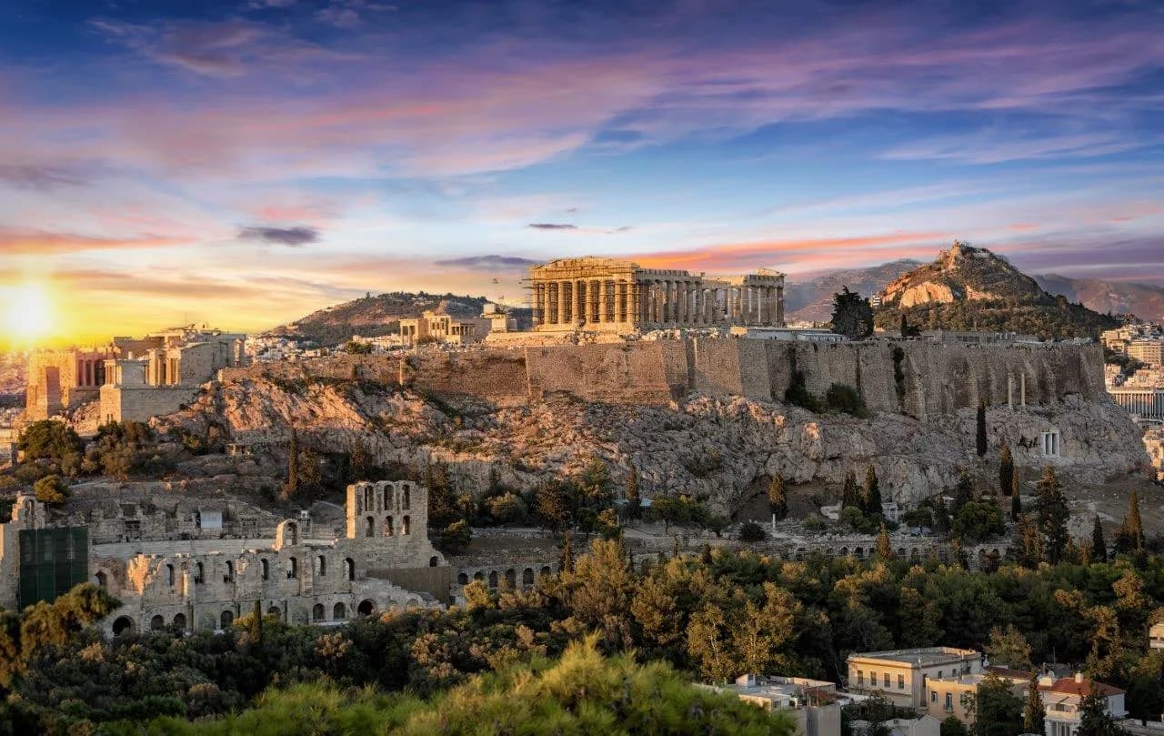 The Acropolis and the Parthenon above Athens at dusk