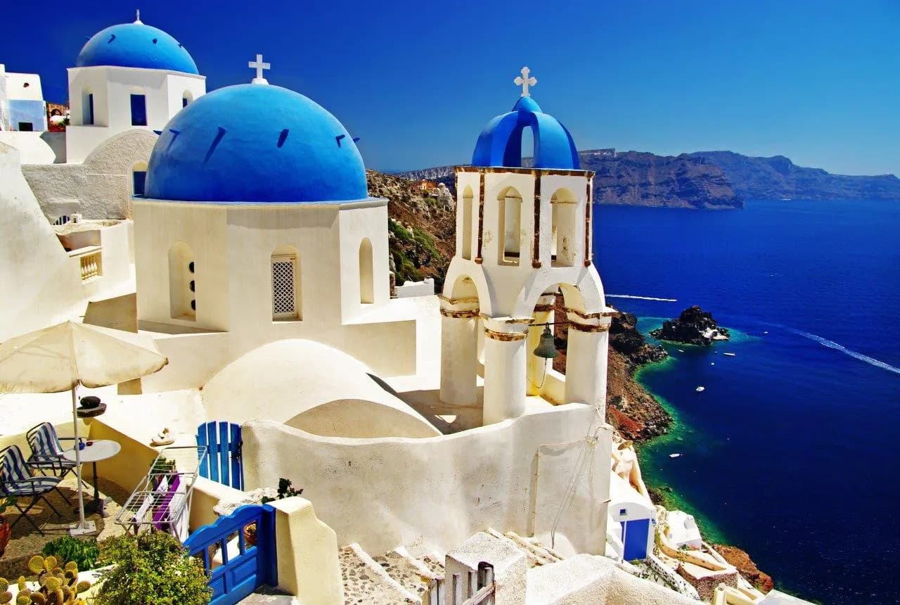 Blue domed churches above the sea in Oia, Santorini