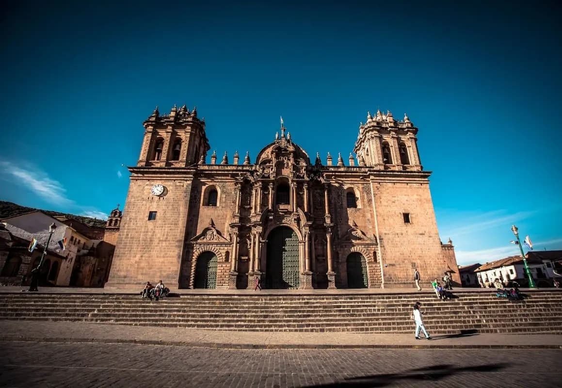 Cusco Cathedral and its steps under a deep blue sky