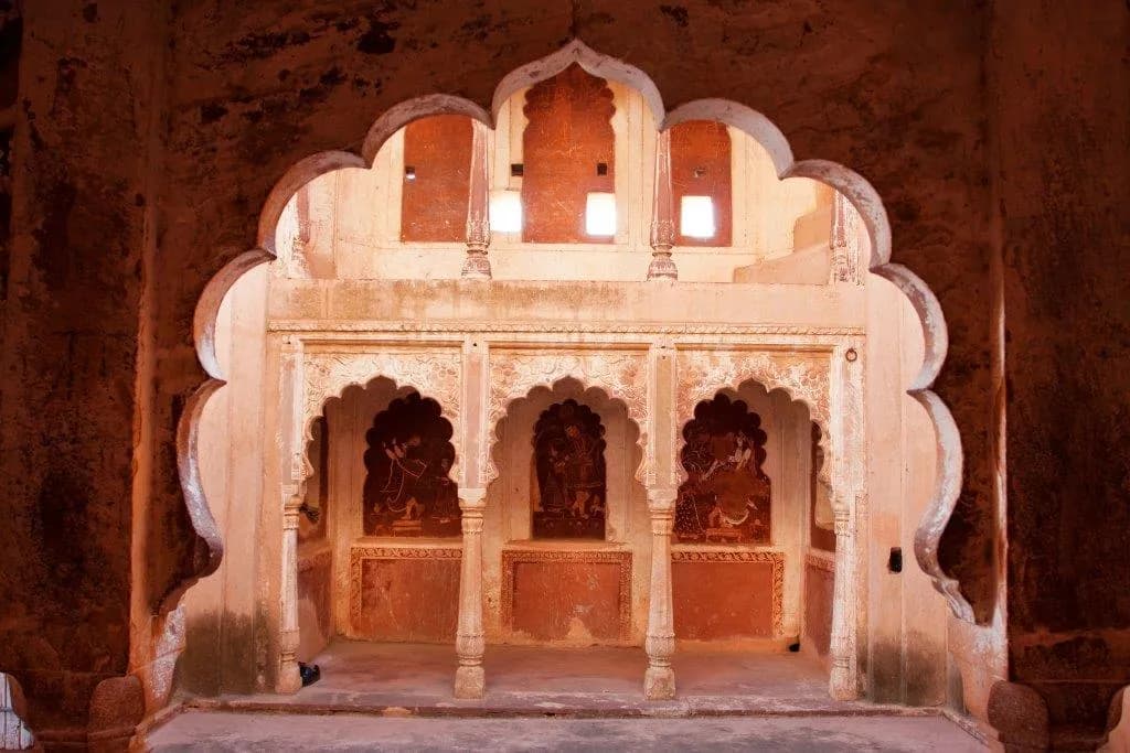 Carved sandstone arches in an old Rajput palace