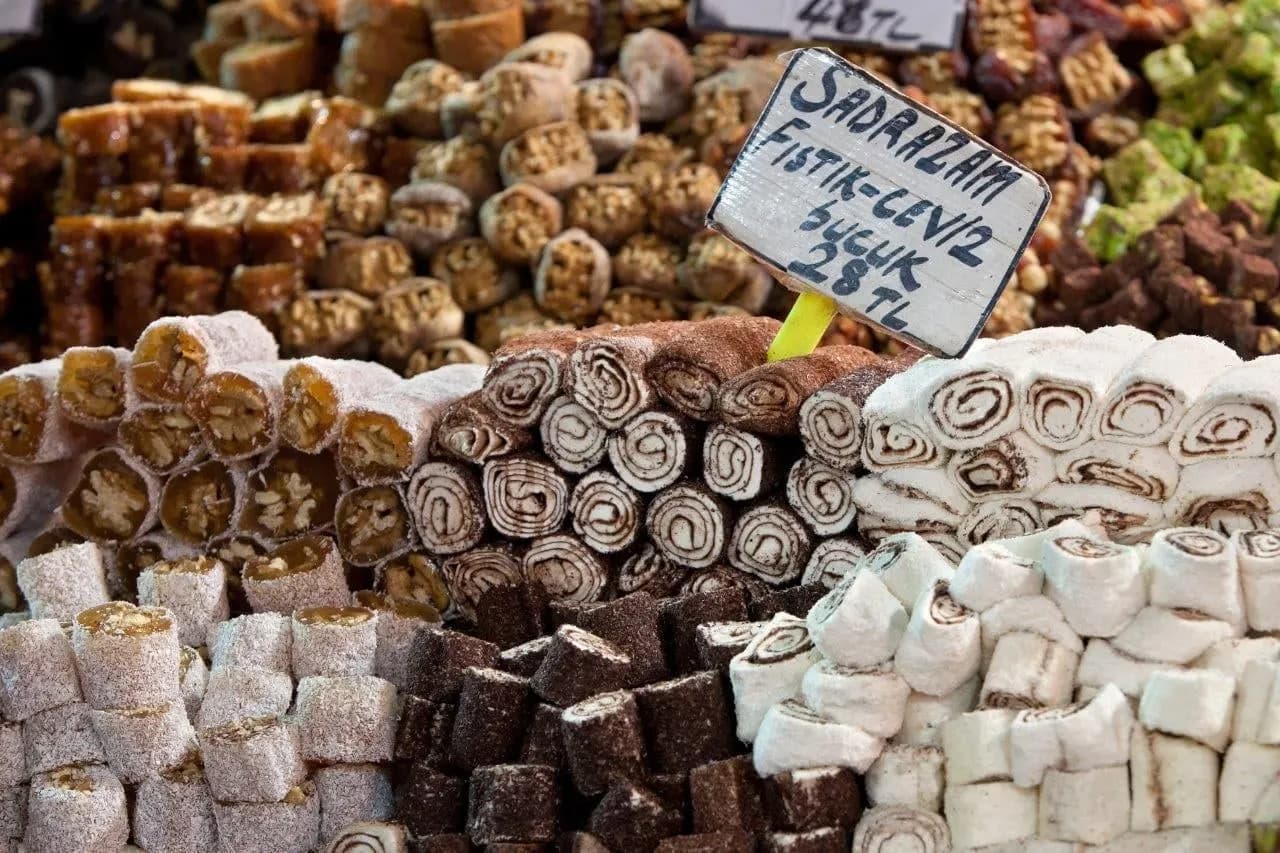 Trays of Turkish delight and nut rolls on a bazaar stall