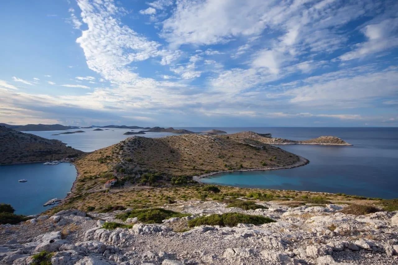 Bare rocky islands and inlets of the Kornati archipelago under a wide sky