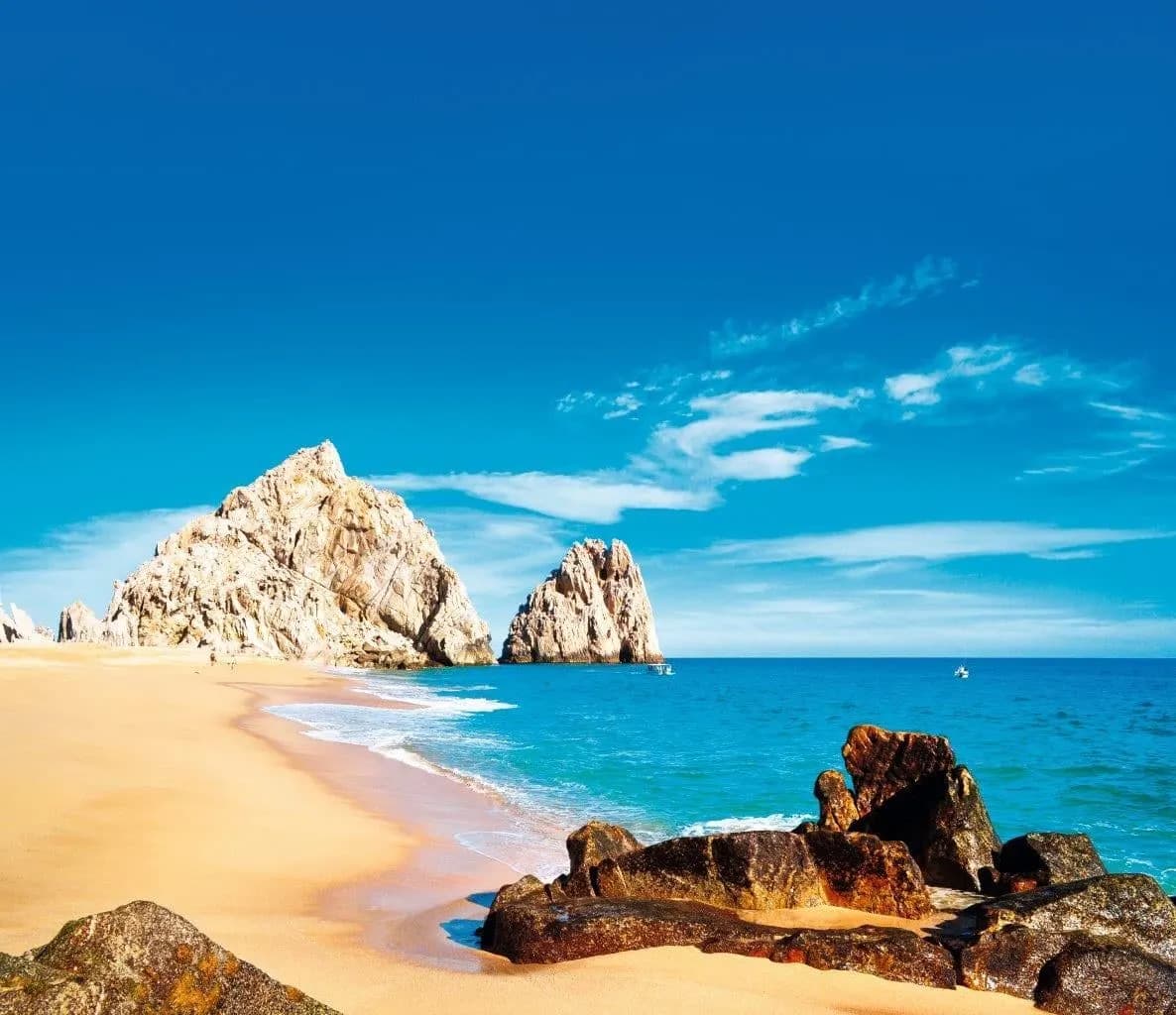 Golden sand and granite rocks on a beach by the Pacific near Los Cabos