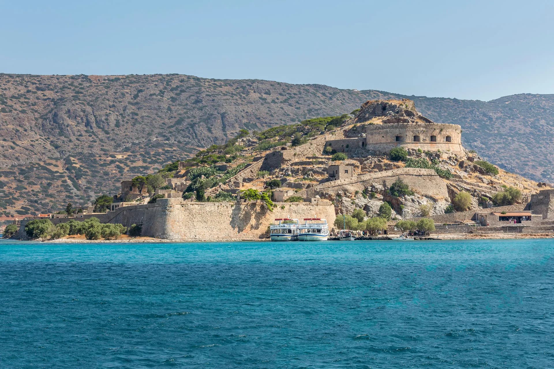 Spinalonga fortress seen from the water of Mirabello Bay