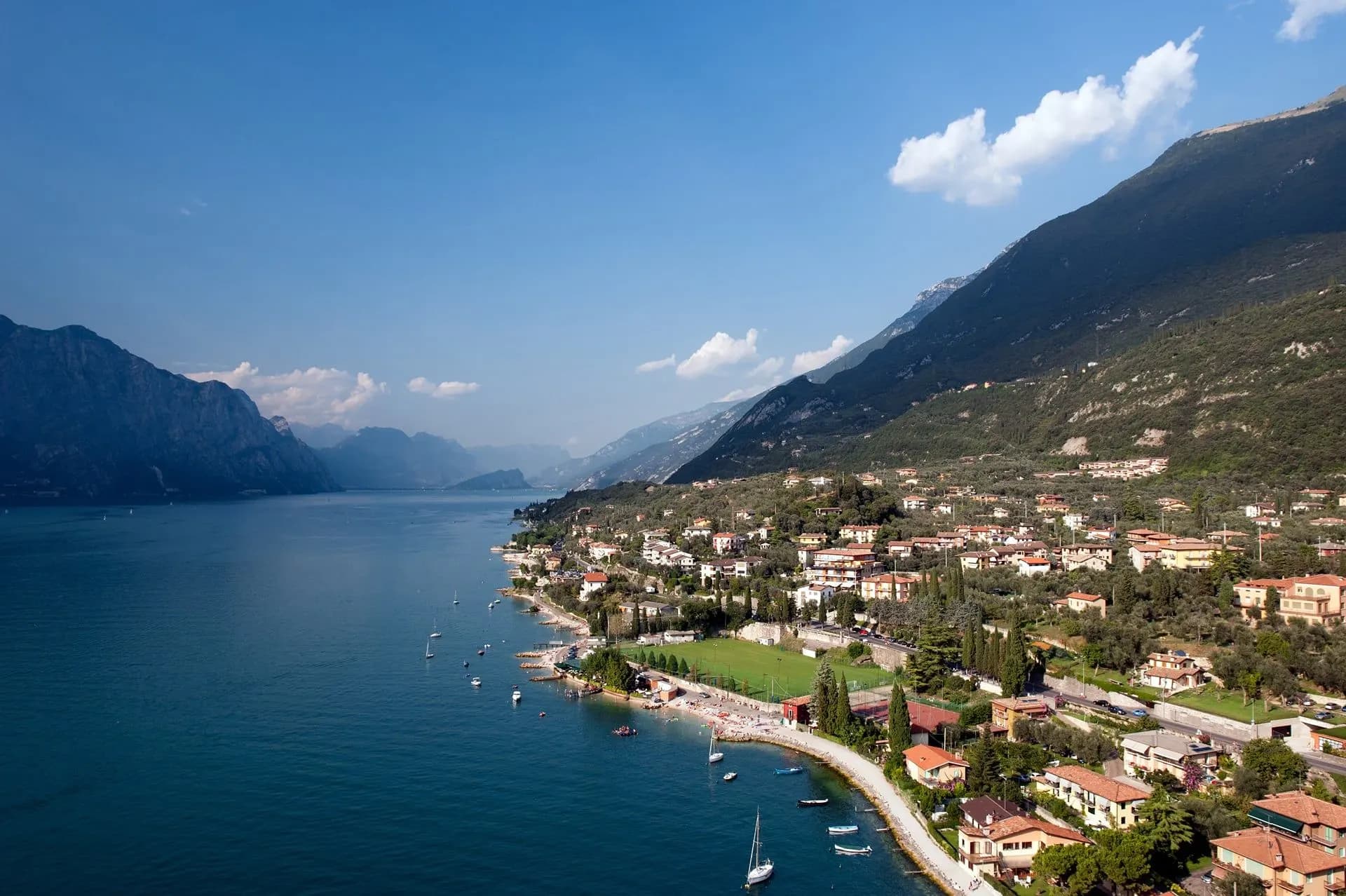 A lakeside town strung along the shore of Lake Garda beneath steep mountains