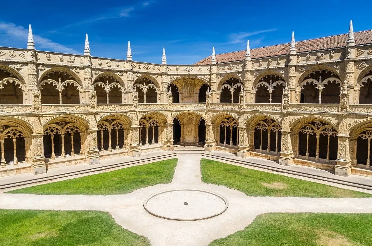 The carved stone arcades of the Jerónimos Monastery cloister in Belém