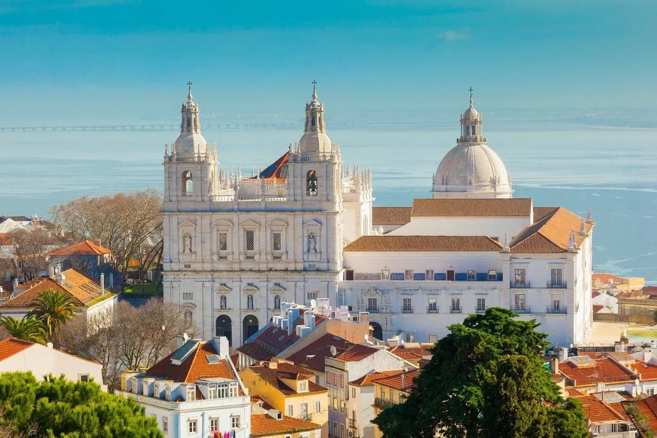 The white towers of São Vicente de Fora and a dome above the Tagus