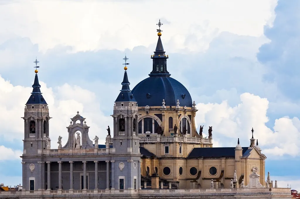 The grey dome and twin towers of Almudena Cathedral in Madrid