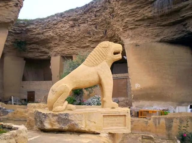 A carved stone lion in the rock quarry of El Coto de las Canteras