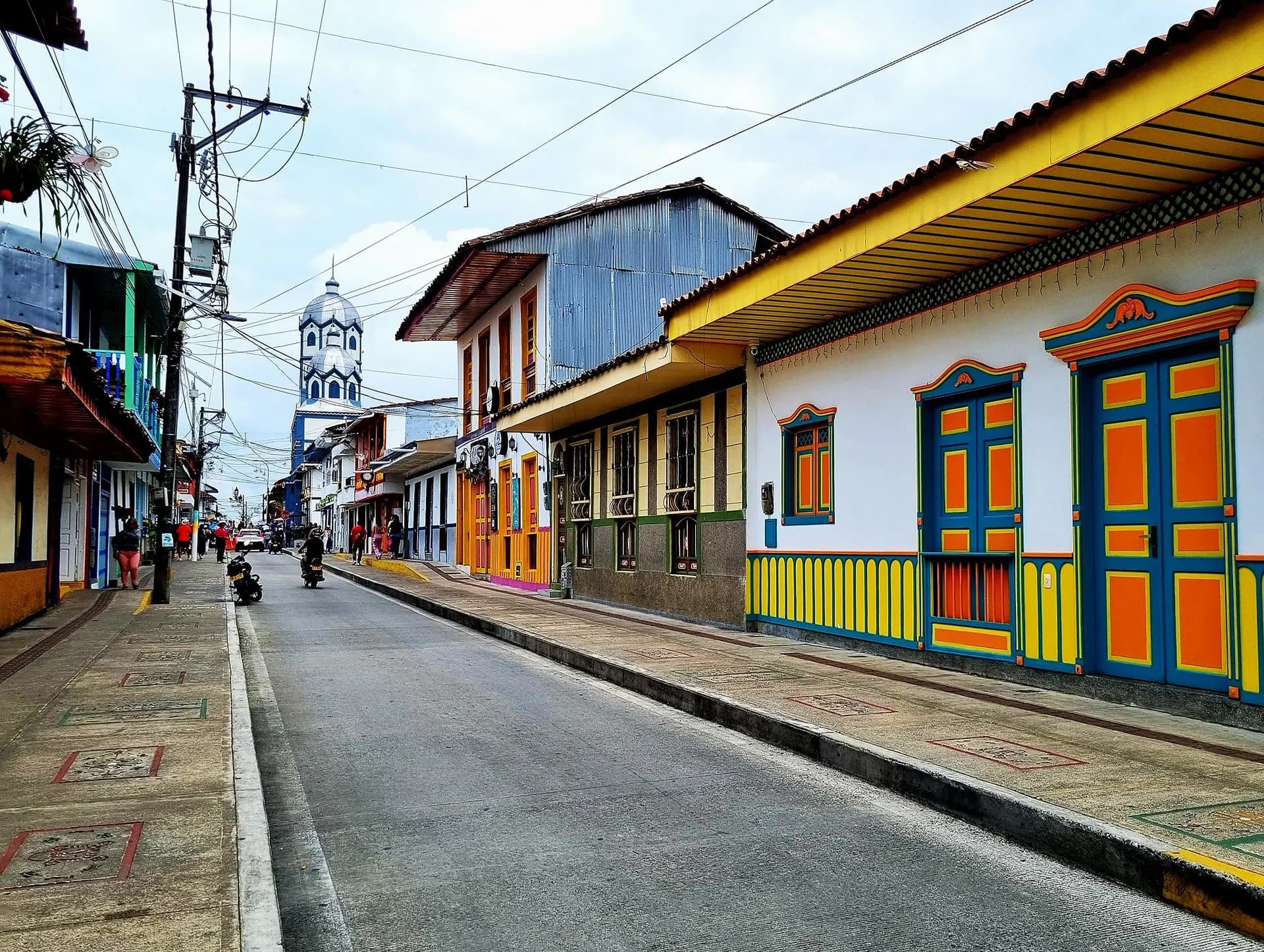 Painted colonial houses with colourful doors along a town street