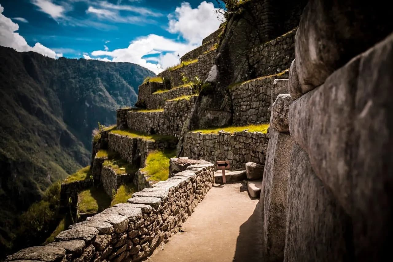 Inca stone walls and terraces at Machu Picchu above a mountain valley