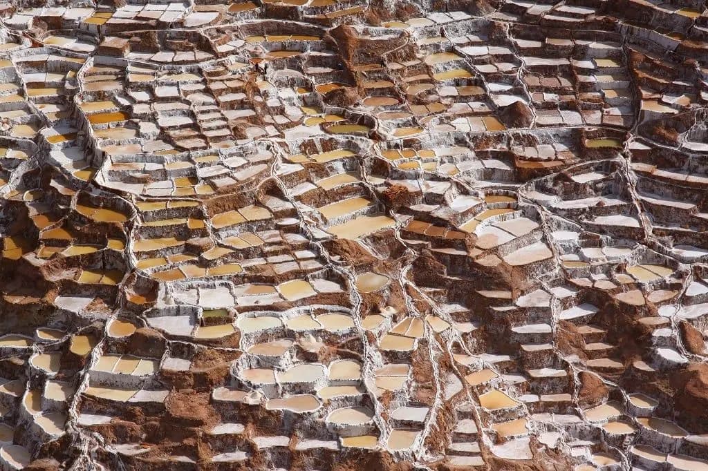 Hundreds of small salt pools stepping down the hillside at Maras