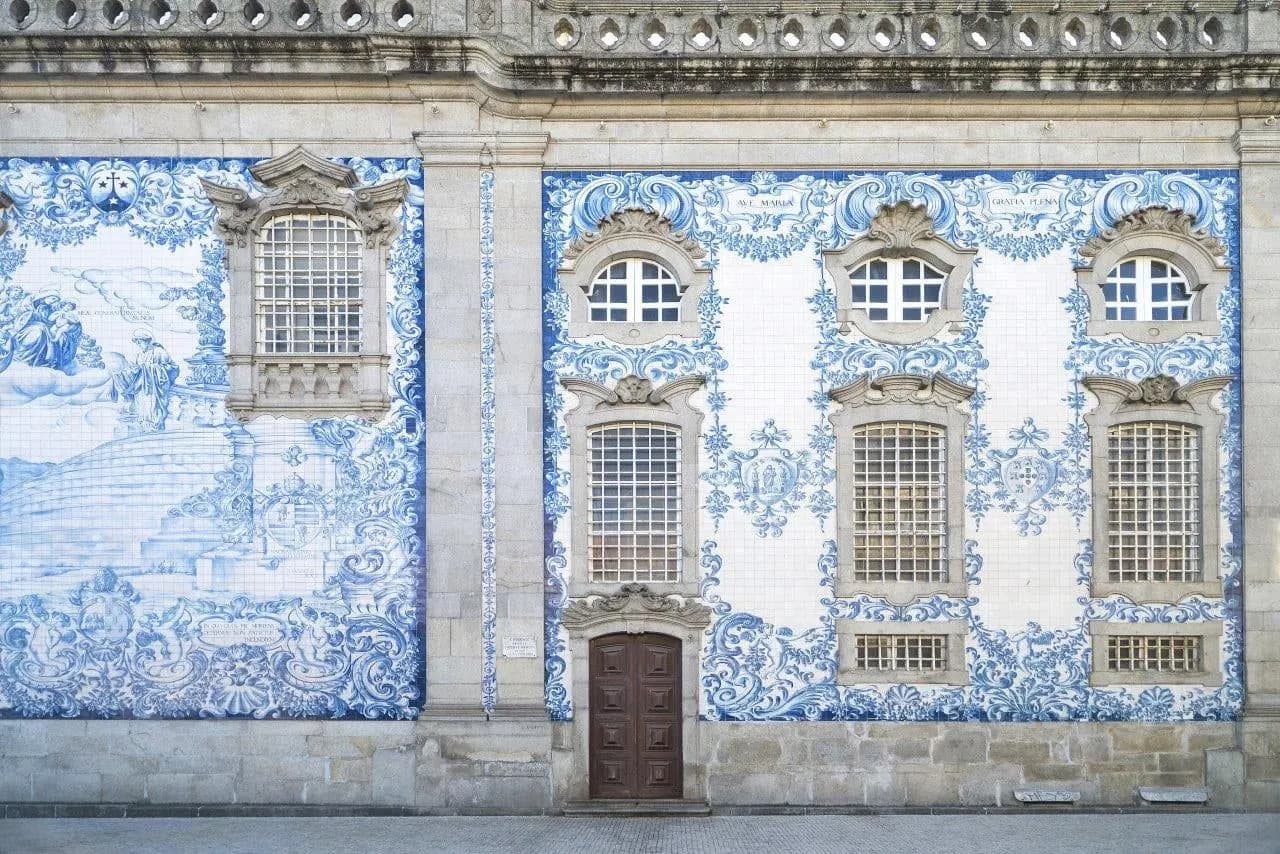 A church wall in Porto covered in blue and white azulejo tiles