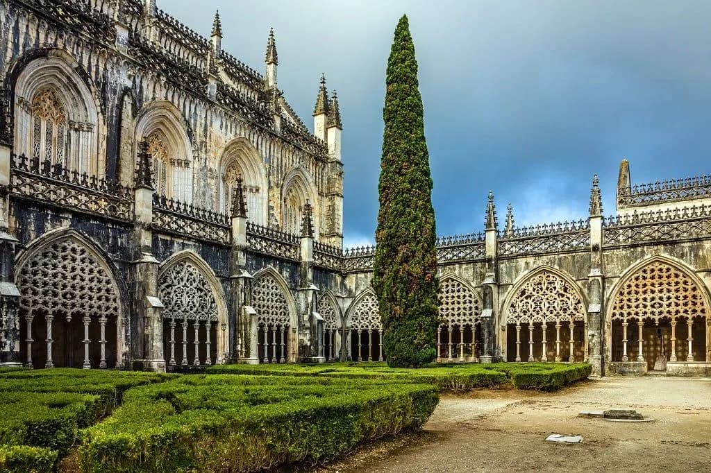 The Gothic cloister and garden of the Batalha Monastery