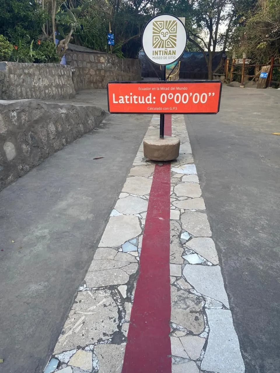 A red line on the ground marking latitude zero