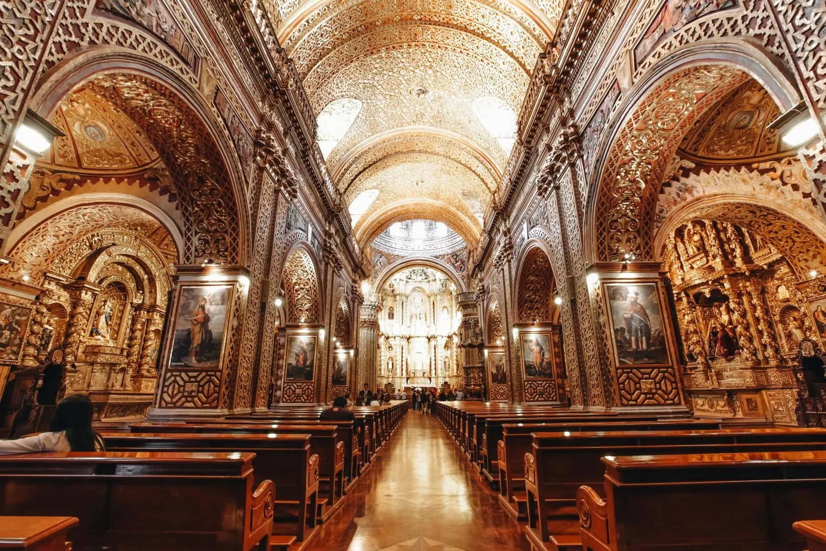 The gold-covered nave and altar of a baroque church