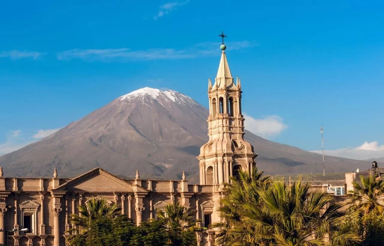 Arequipa Cathedral's bell tower with El Misti volcano behind