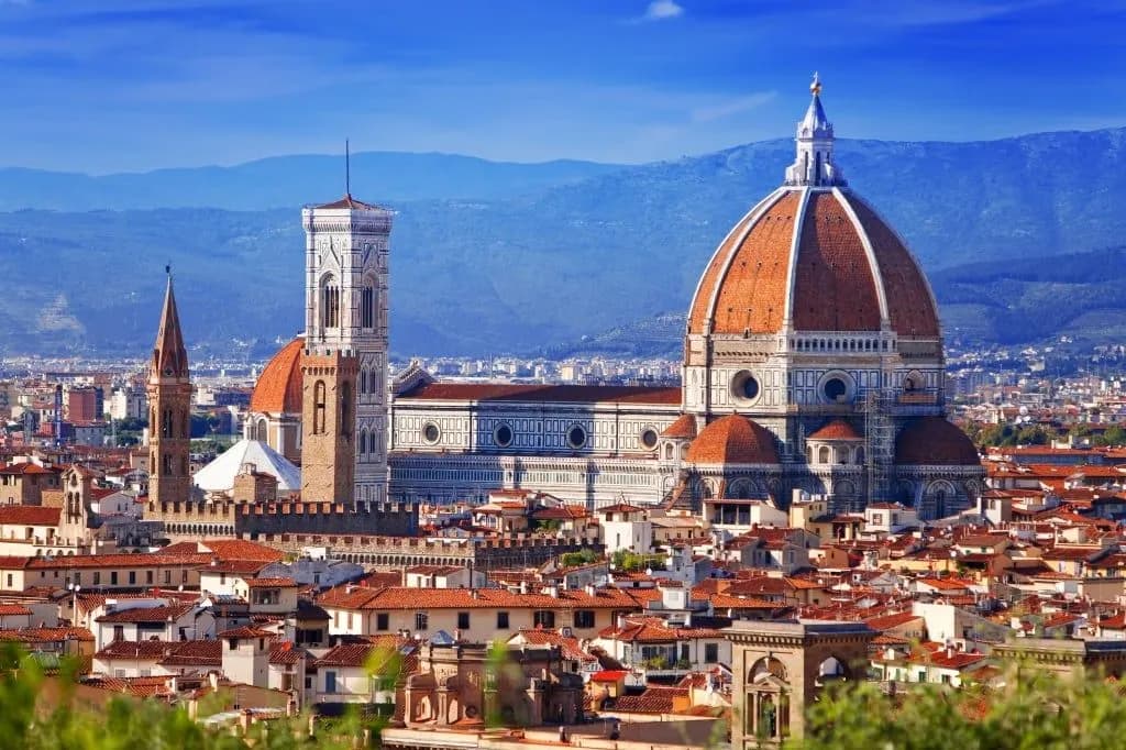 The dome of Florence Cathedral and Giotto’s bell tower above the city rooftops