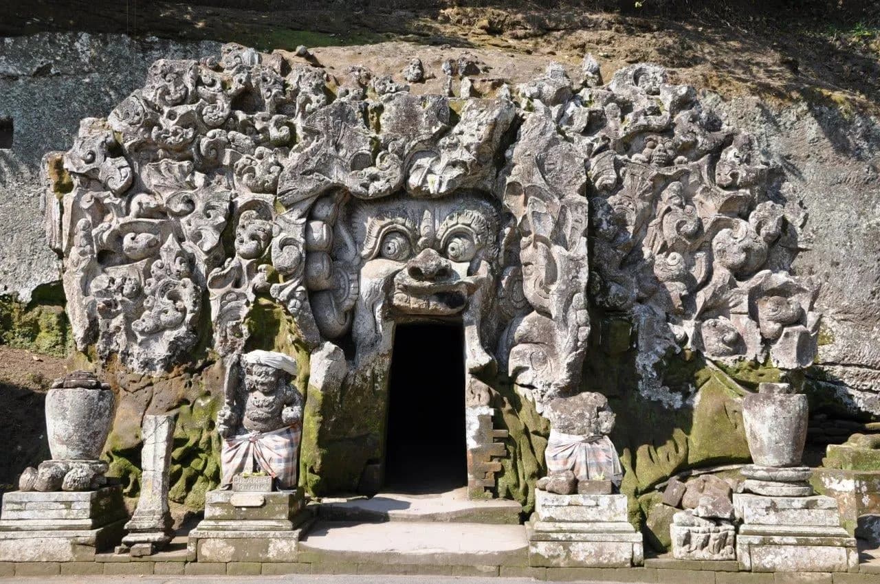 The carved stone face around the entrance of Goa Gajah, the Elephant Cave