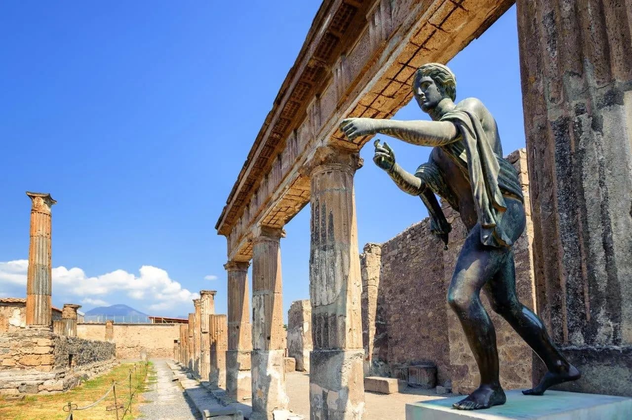 The bronze statue of Apollo among the columns of his temple at Pompeii