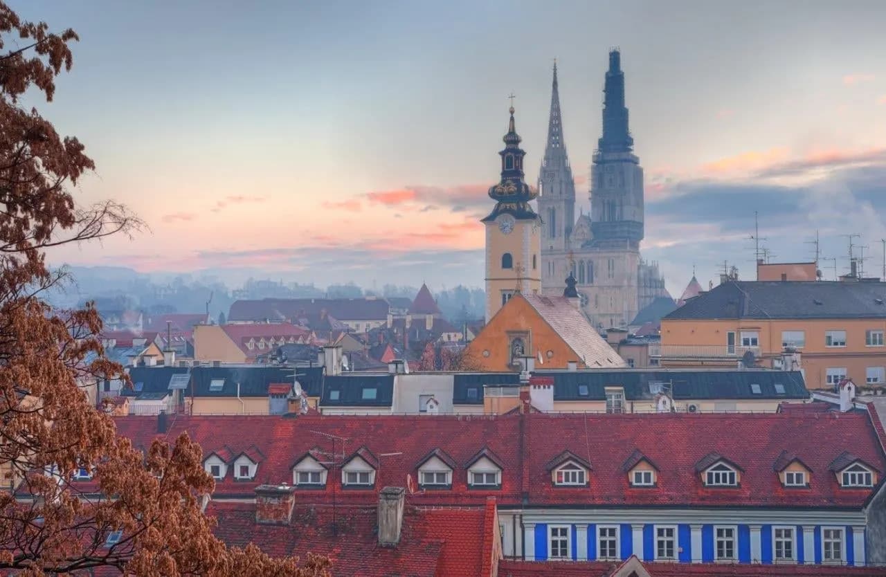 Church towers and rooftops of Zagreb's old upper town at dusk