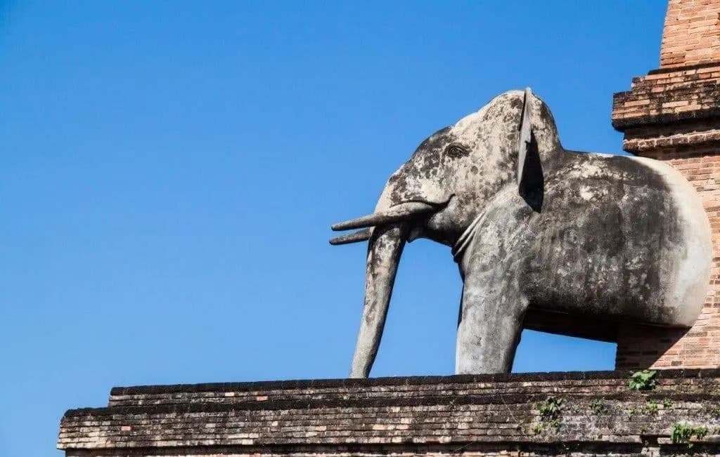 A stone elephant on the brick base of Wat Chedi Luang in Chiang Mai