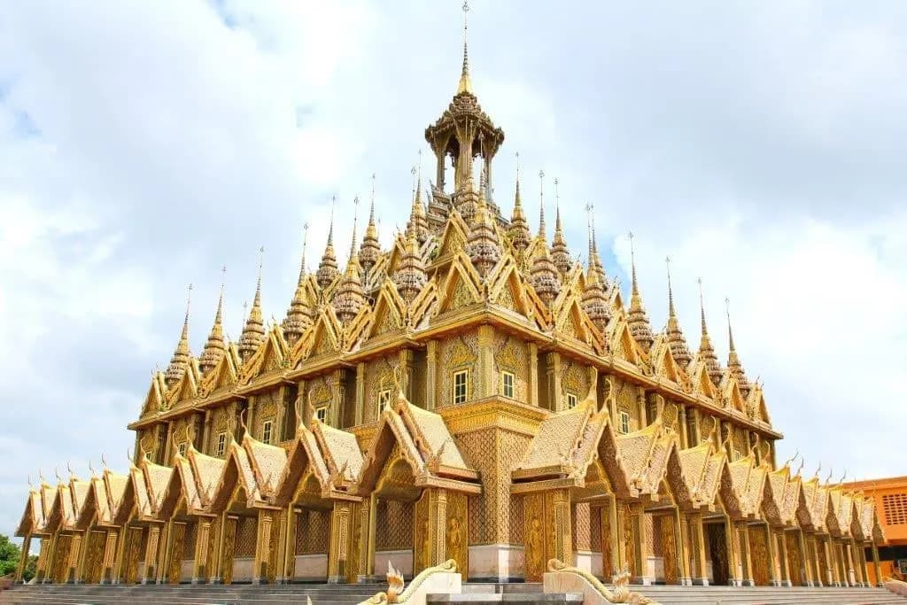 A golden temple crowned with tiers of slender spires