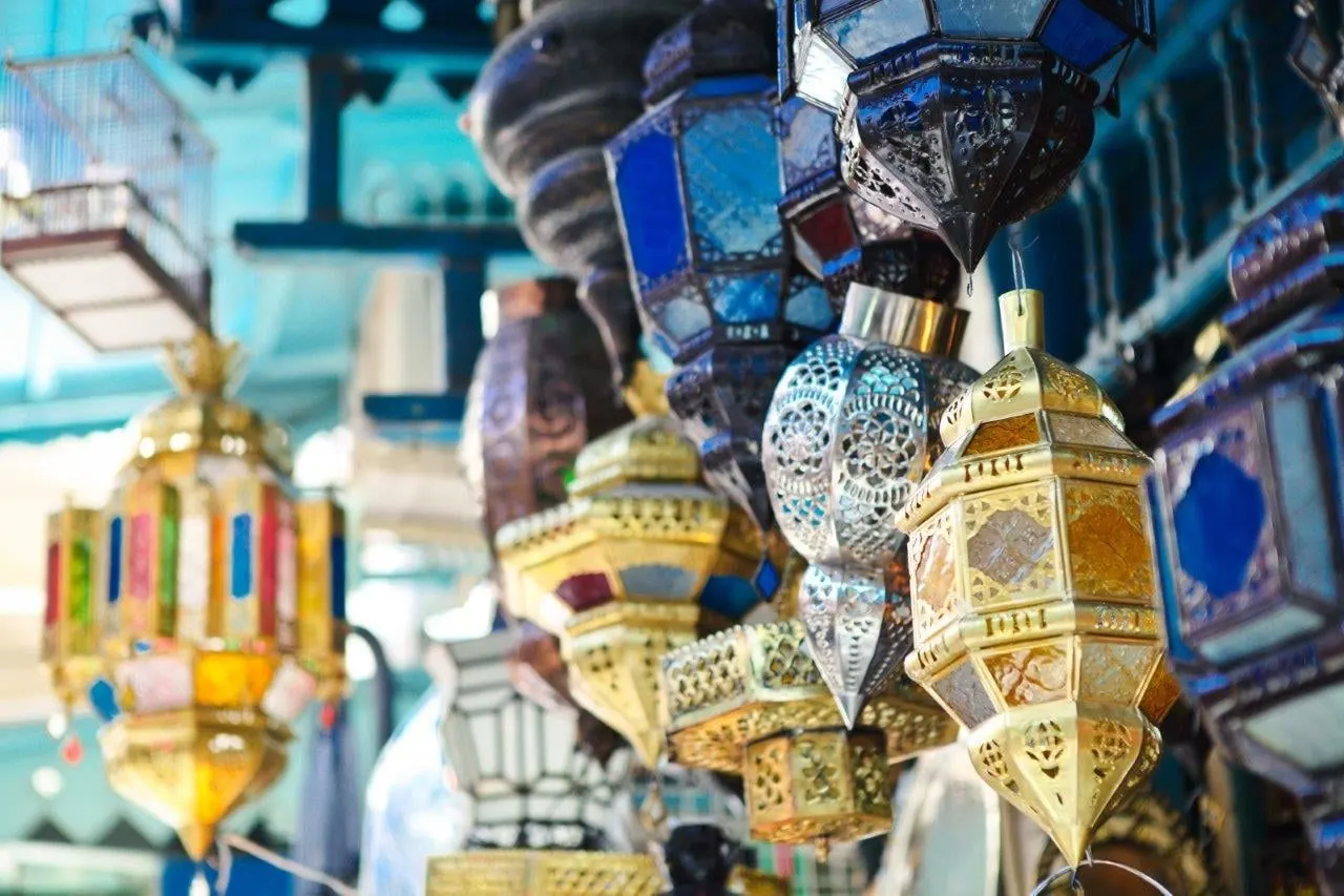 Brass and coloured glass lanterns hanging in a souk