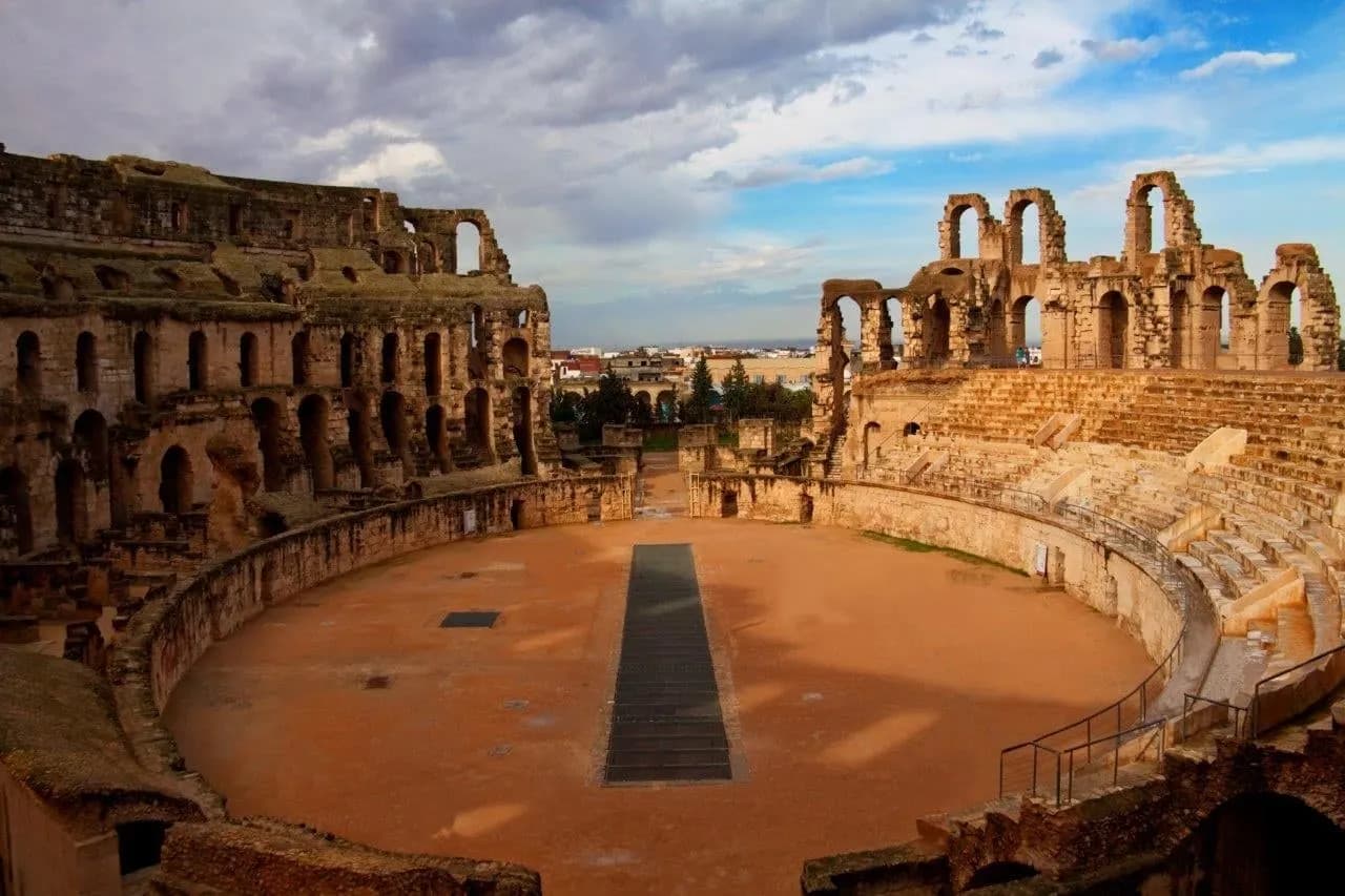 The arena and tiered stone walls of the Roman amphitheatre at El Djem