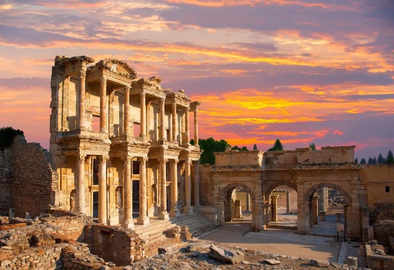 The Library of Celsus at Ephesus under a sunset sky