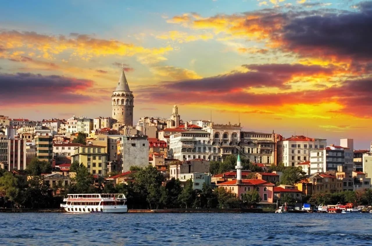 The Galata Tower above Istanbul's waterfront at sunset