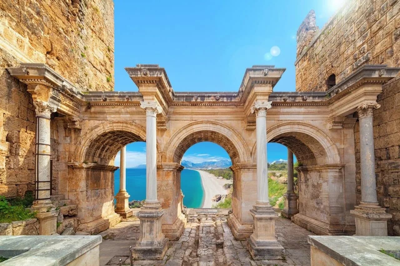 Hadrian's Gate in Antalya, with the sea seen through its arches