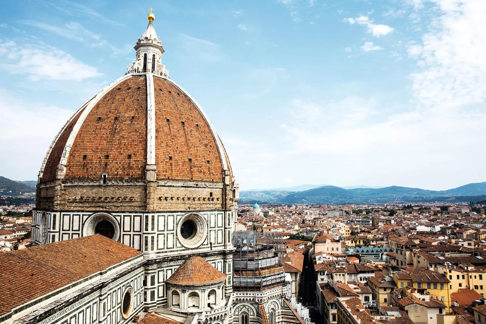 Brunelleschi's brick dome seen up close above the rooftops of Florence