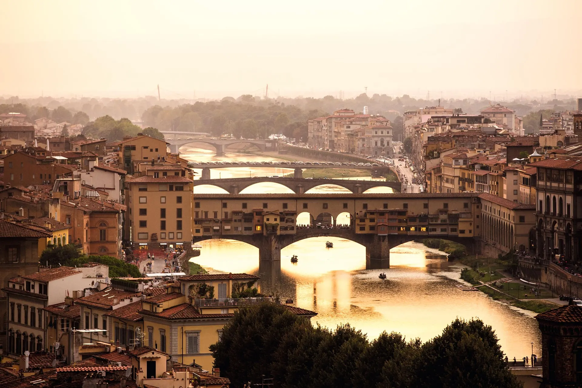 The Ponte Vecchio and the bridges over the Arno in Florence in golden evening light
