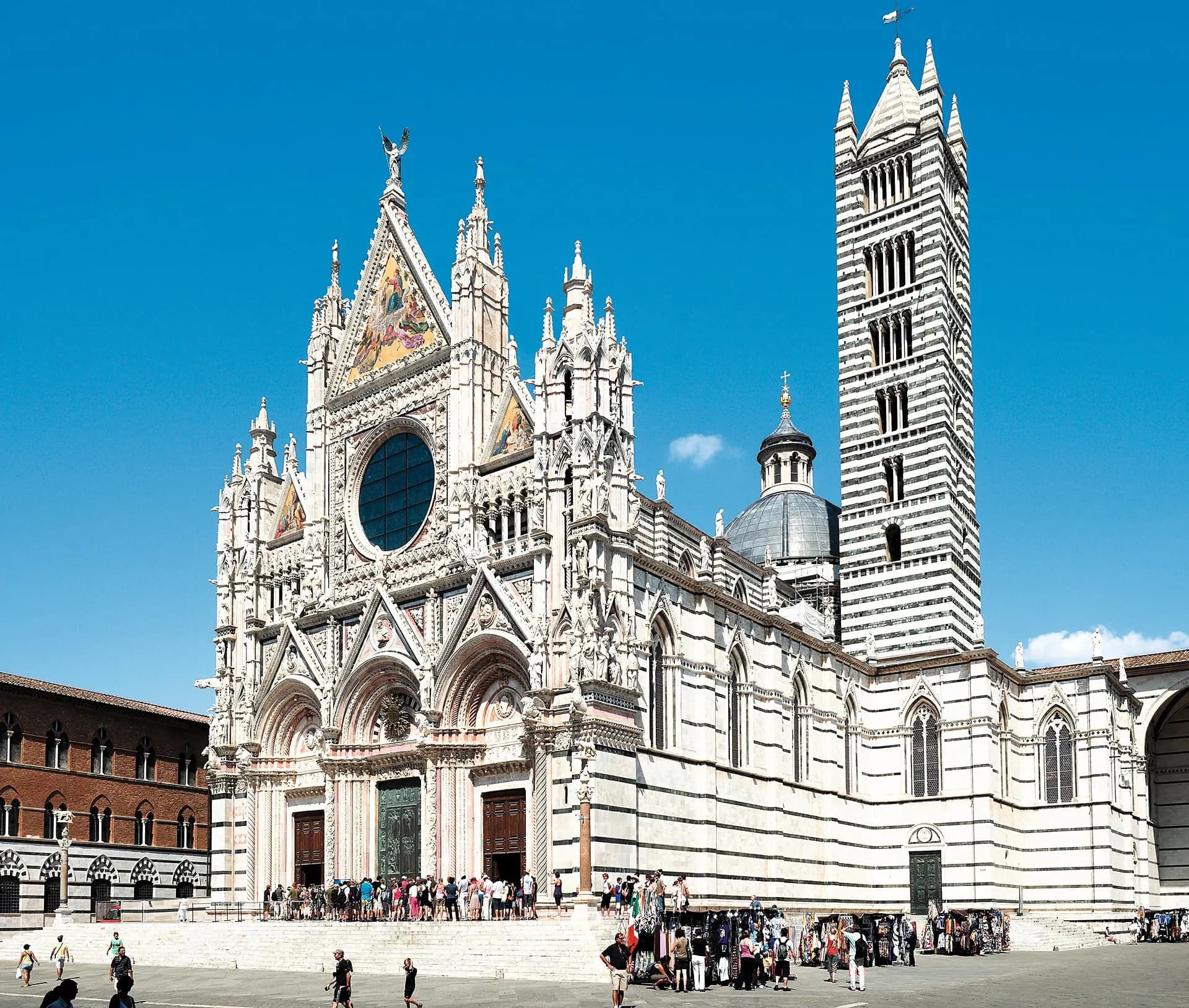 The striped marble front and bell tower of Siena Cathedral