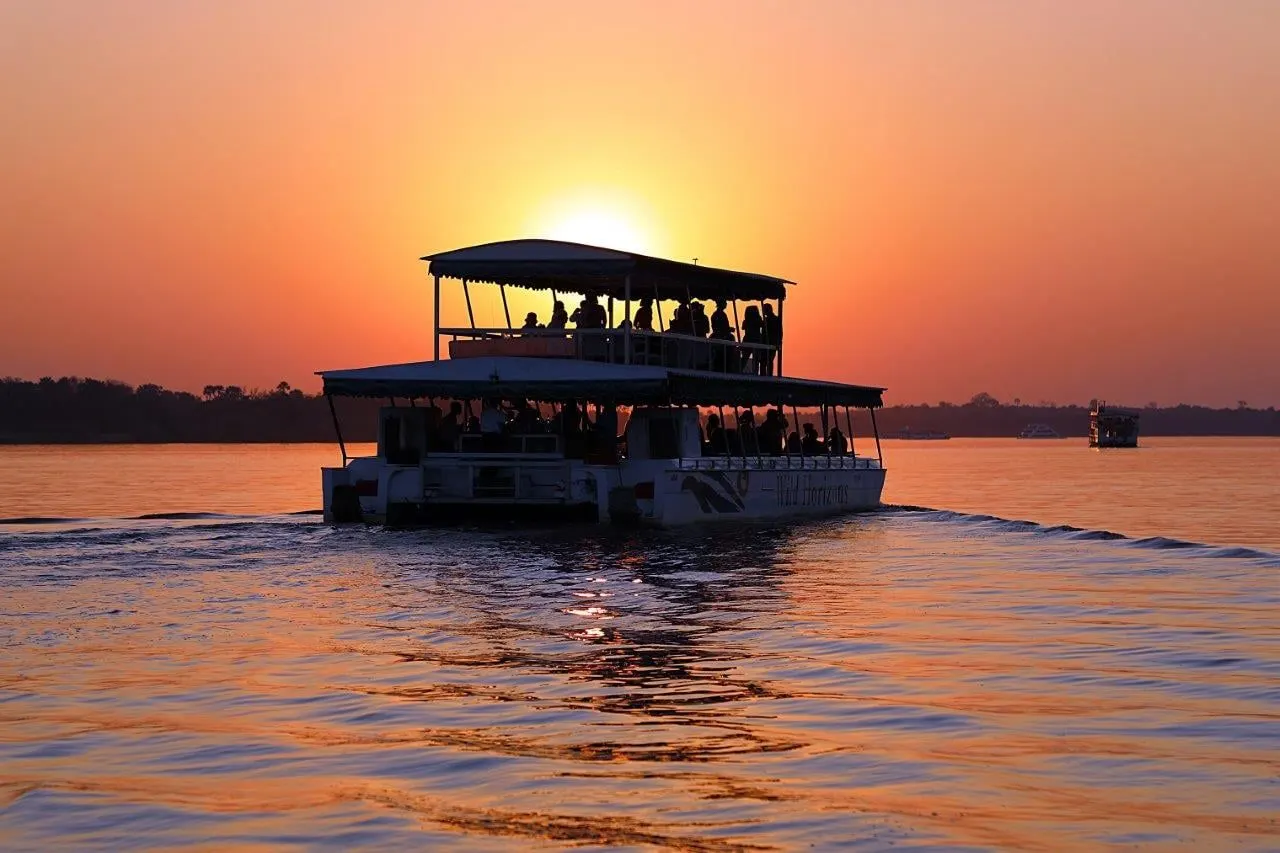 Arrive and cruise the Zambezi at sunset