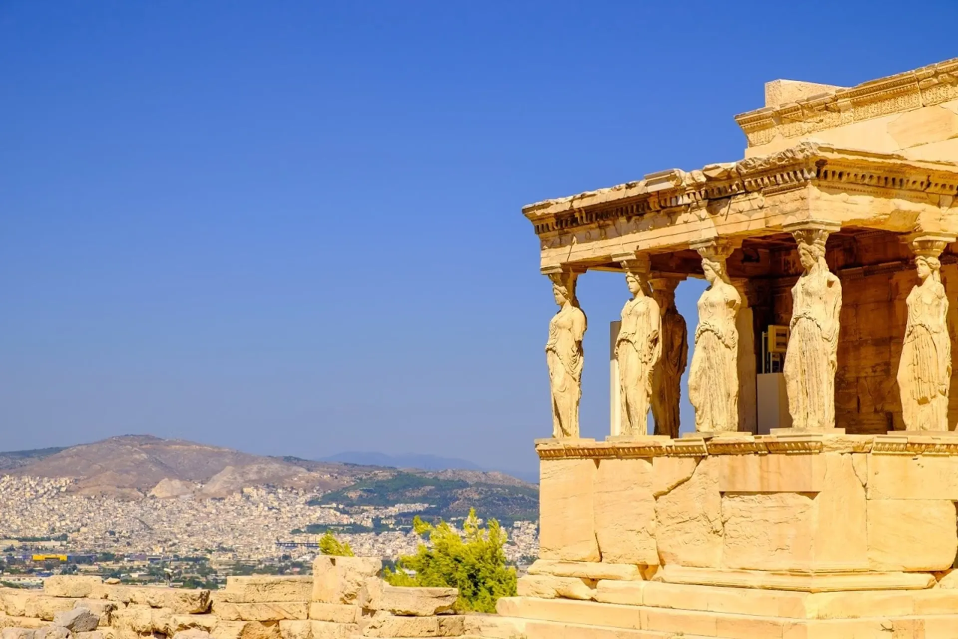 The Caryatid porch of the Erechtheion looking over Athens