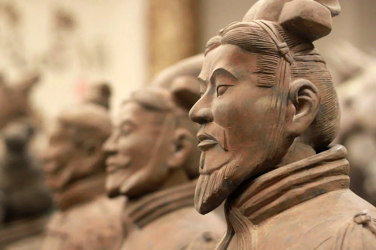 Close view of the carved faces of terracotta warriors