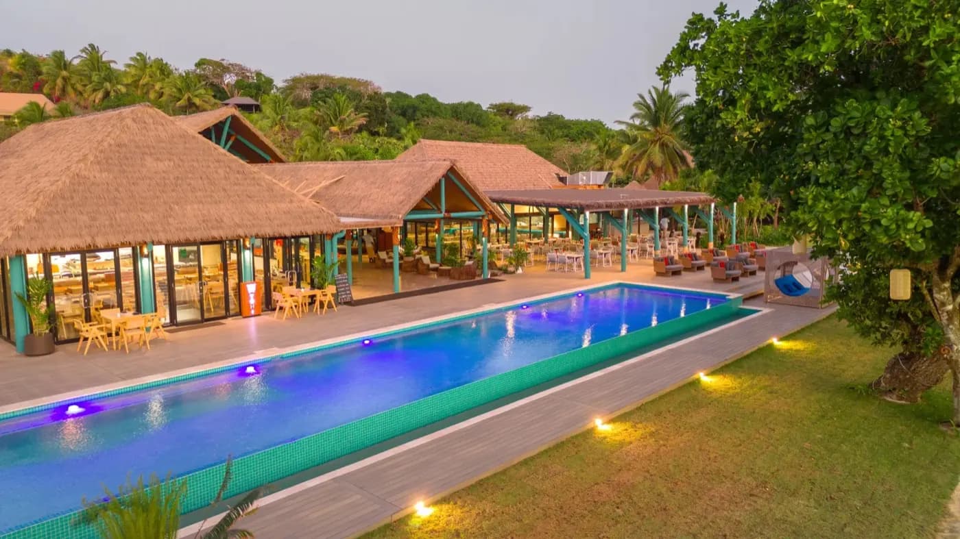 Pool and restaurant at dusk