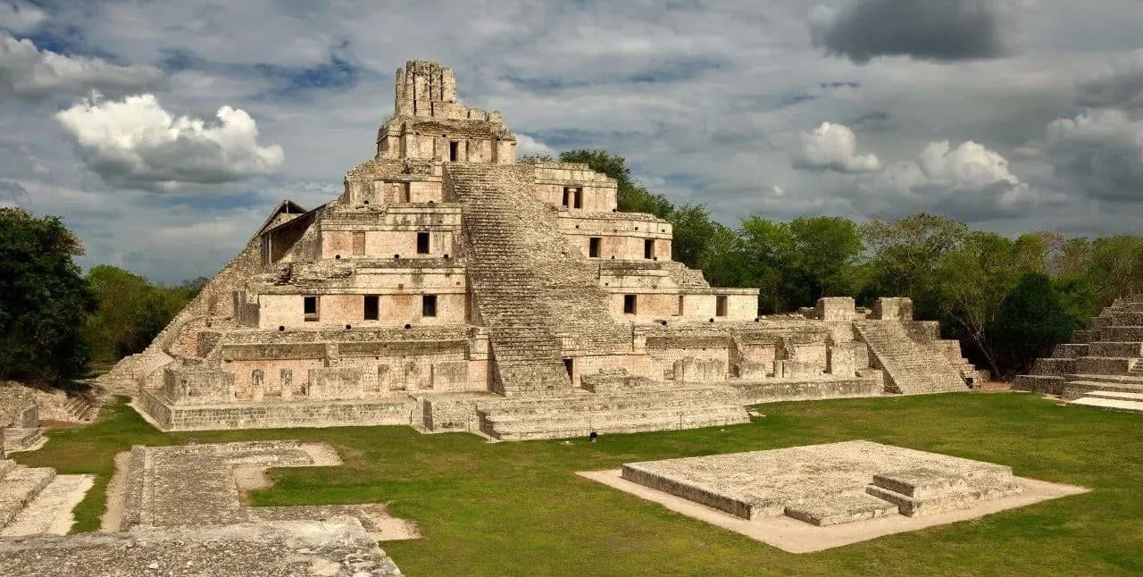The Pyramid of the Five Levels at Edzna above a grassy plaza