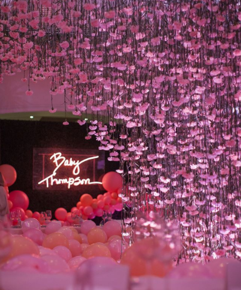 Khloe Kardashian pink baby shower with neon sign