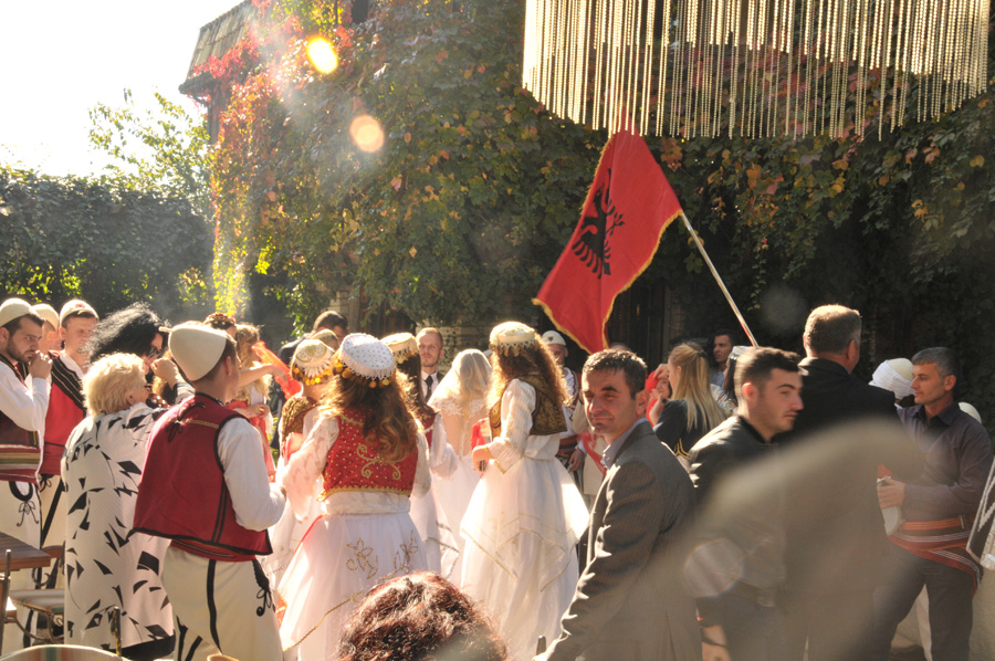 albanian wedding outside with flag