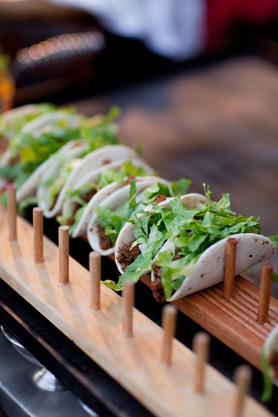 tacos on a wooden stand