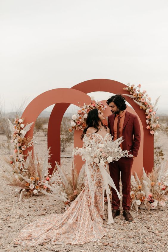 Texas wedding with pops of Terracotta colored arches as accents