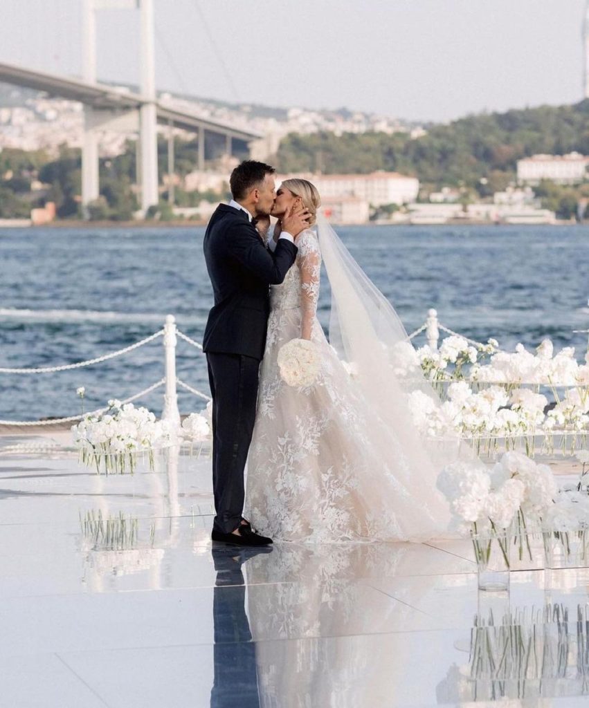 Bride and groom with destination weddings highlight Bosporus Strait in the background
