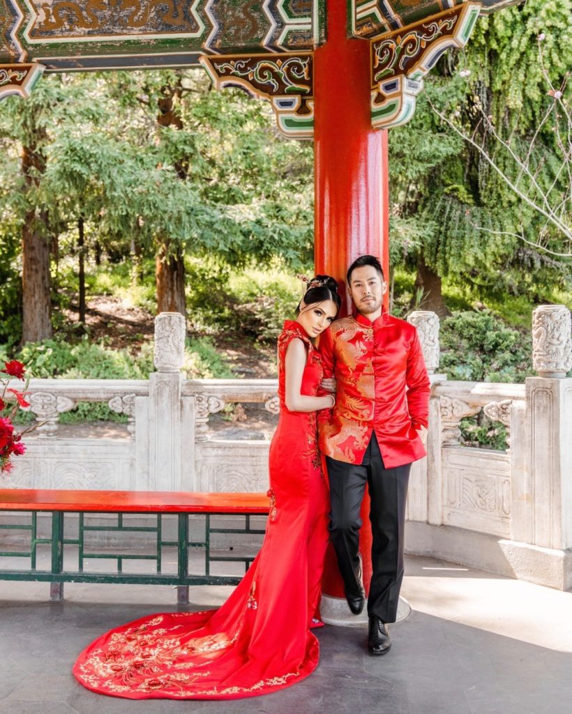 Bright red traditional Chinese Cheongsam with floral embroidered trail