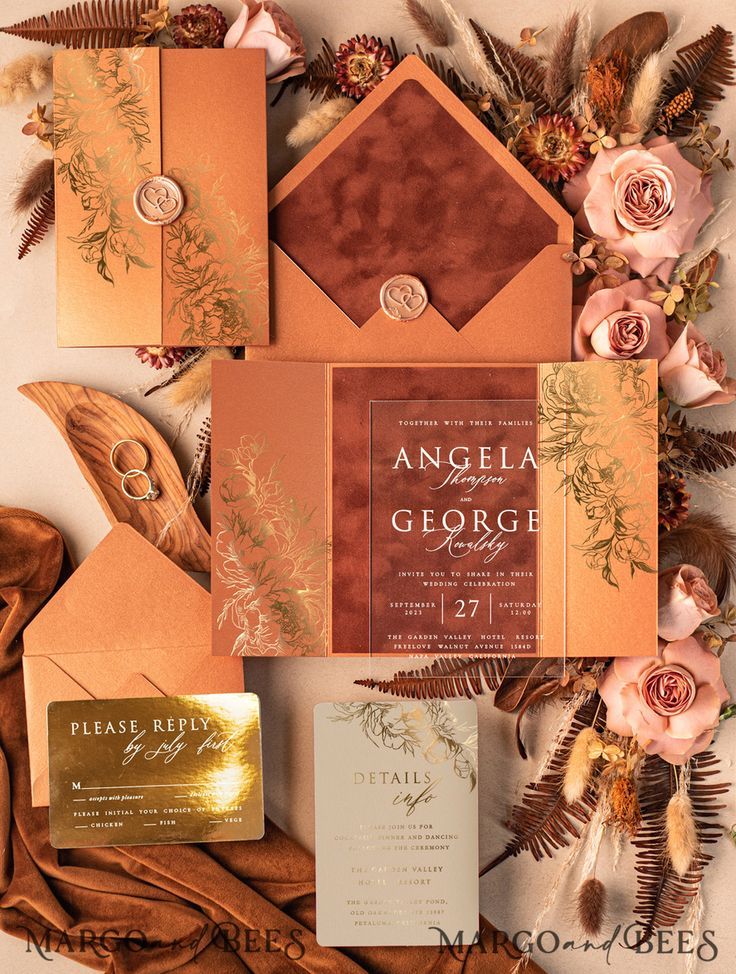 Elegant invitation cards featuring different shades of rust and textures like shimmer and velvet