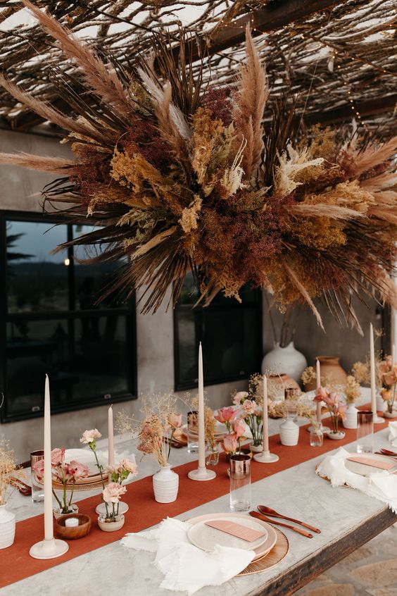Dried floral installation features rust colors giving dramatic effect